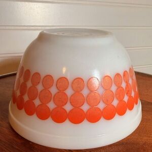 This is a vintage Pyrex Mixing Bowl in the "New Dot" pattern in orange dots.